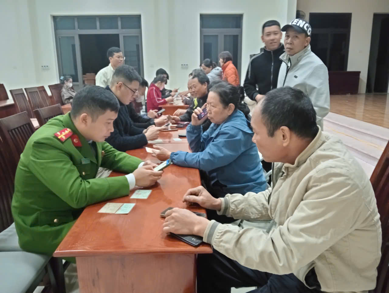 A group of people sitting at a table  Description automatically generated