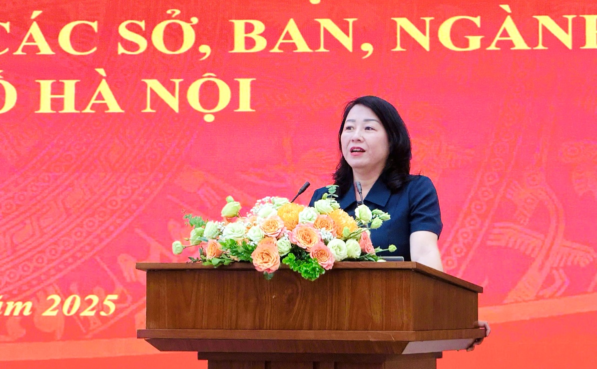 A person standing at a podium with flowers  AI-generated content may be incorrect.