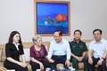Hanoi People's Council Chairman Nguyen Ngoc Tuan visits national contributors